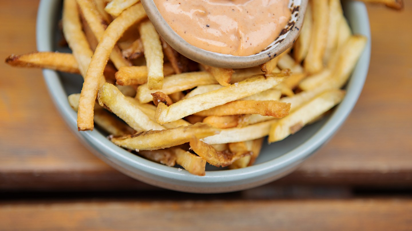 a close up of a bowl of fries