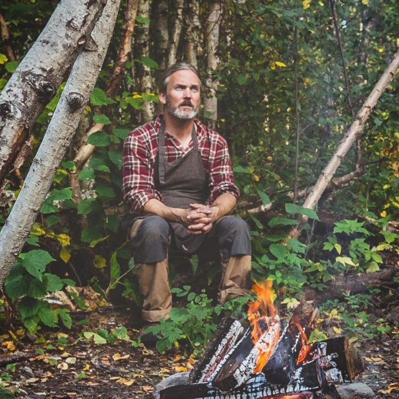 a man sitting in a tree