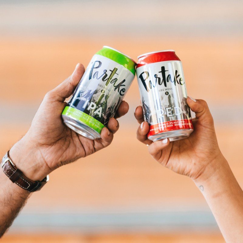 a hand holding a can