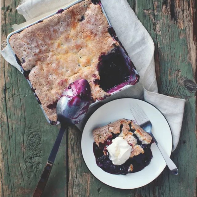 a slice of cake sitting on top of a wooden table