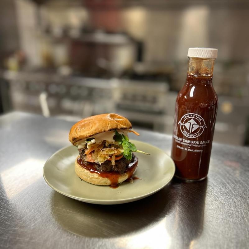 a close up of a bottle and a glass of beer on a table